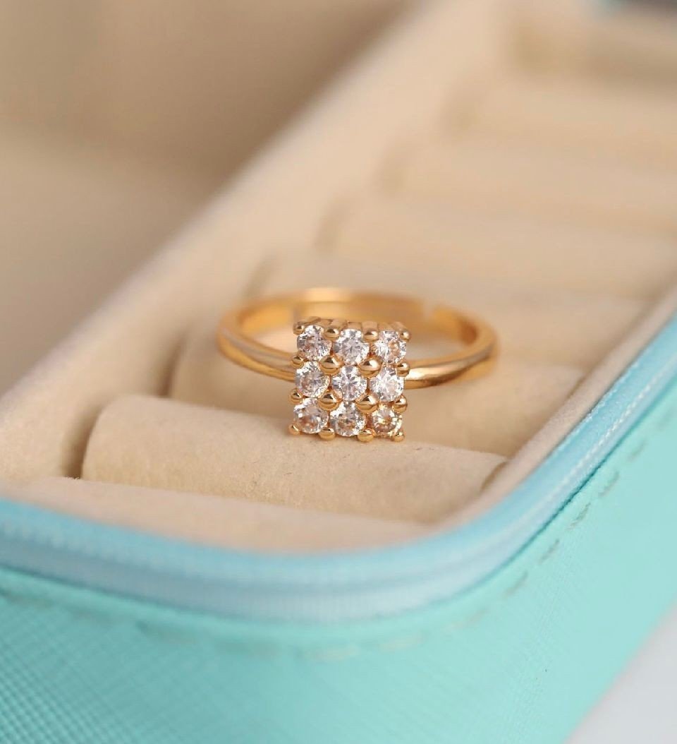 The Radiant Nine Stone Cluster Ring